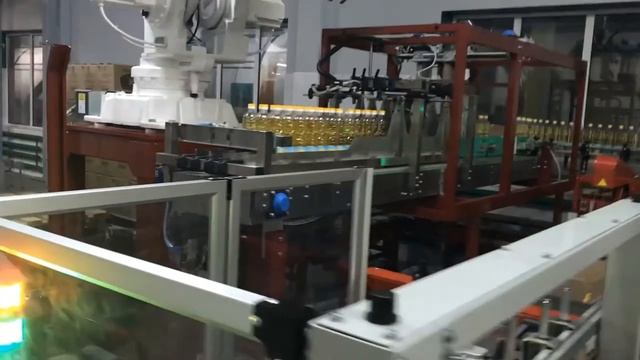 Роботизированный комплекс для укладки  бутылок в короба и коробов на паллету