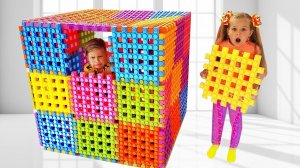 Diana and Roma Playing with Toy Blocks