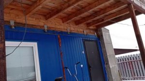 Дом из двух бытовок с мансардой и балконом.