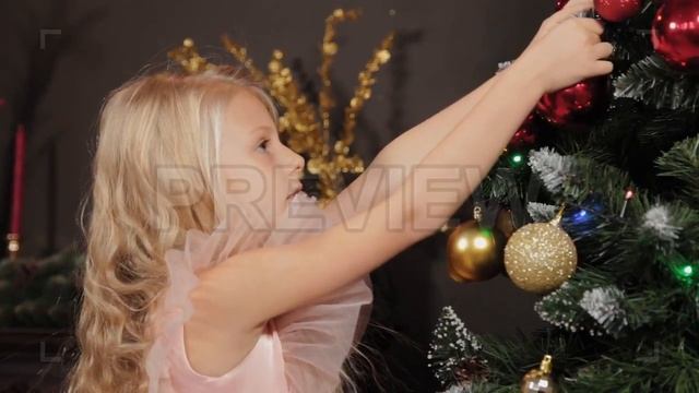 Girl Decorates Christmas Tree Stock Video смотреть онлайн