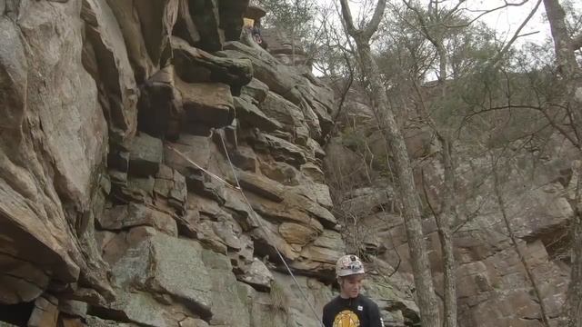 Climber, wearing a helmet, gets hit on the head with a rock. смотреть онлайн
