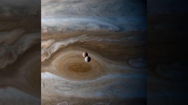 Ио и Европа на фоне Юпитера.