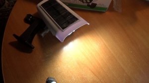 Светодиодный фонарь с датчиком движения на солнечной батарее, В корпусе камеры наблюдения.