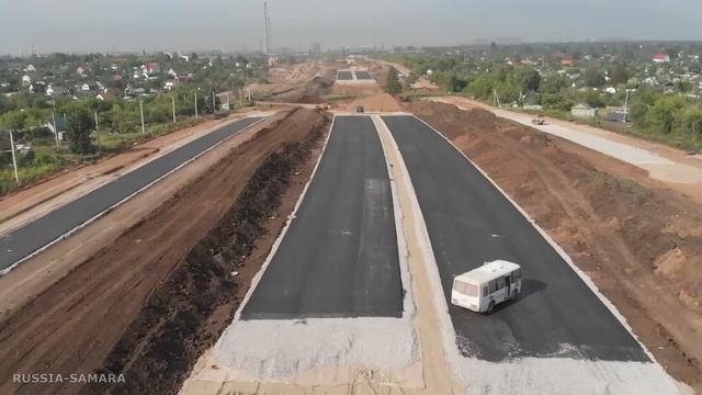 Асфальт и котлованы / прорисовка будущей трассы / автомагистраль Центральная / город Самара / Russi смотреть онлайн