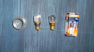 Как заменить лампочку в духовке ?