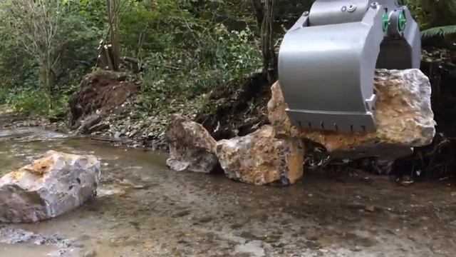 Многофункциональный грейфер перемещение камней