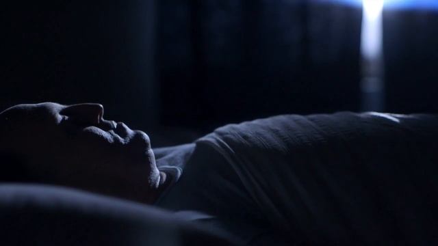 FREEDIO “Sleeping man wakes up after alarm“ royalty free HD stock video footage смотреть онлайн
