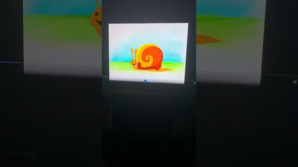 Baby Hannah watching her tiny love DVD MagiQ