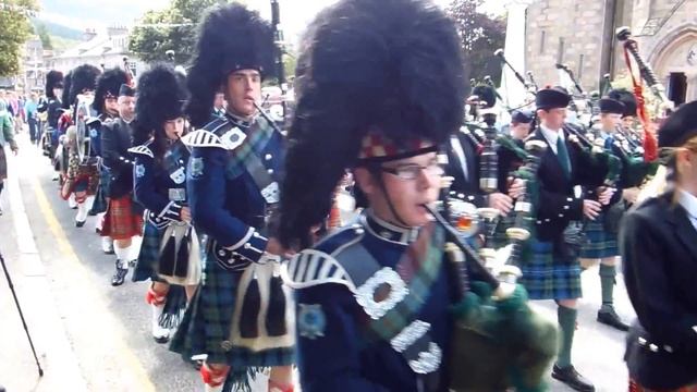 Scottish Bagpipe Band Marching Through Ballater, August 2012