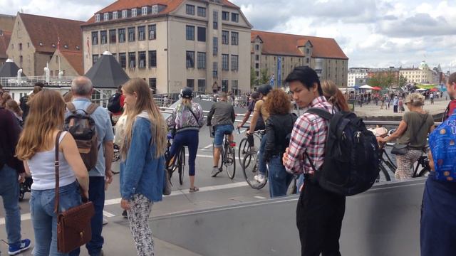 People Walking And Riding Bikes At The Trangravsbroen (Butterfly Bridge) In Copenhagen