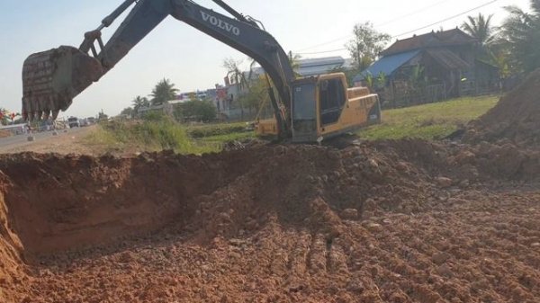 Excavator VOLVO EC210BLc at Work - Construction Machinery in Cambodia