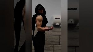 Beautiful muscle girl flexing big biceps