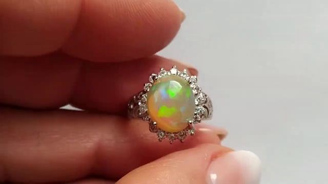 Кольцо с природным эфиопским опалом 2.81ct, кабошон 11.3х9.4 мм, день смотреть онлайн