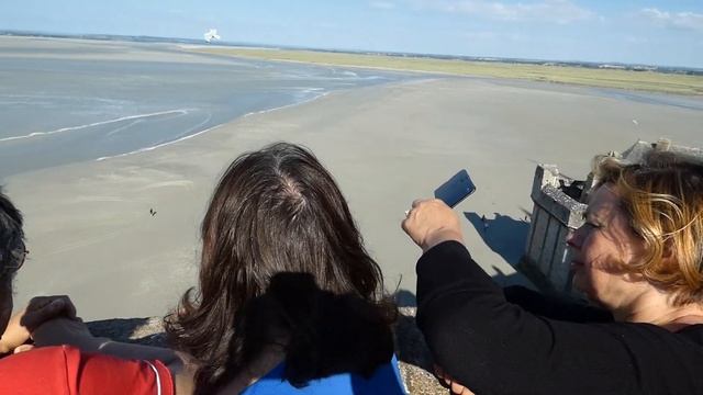 Safety wardens react as foolish walkers risk their lives - high tide Mont St Michel Normandy France смотреть онлайн