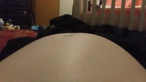 Kyra laughing at her bellybutton