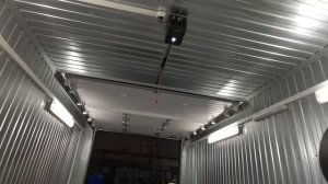 Автоматические подъемные ворота в гараж из контейнера