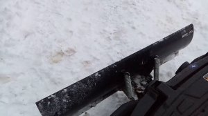 Уборка снега квадроциклом Polaris  с отвалом.