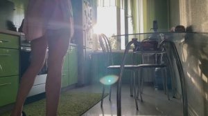 Fit girl cleaning in the kitchen