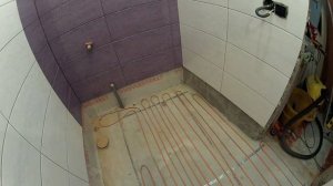 Укладка электрического пола в душевом трапе