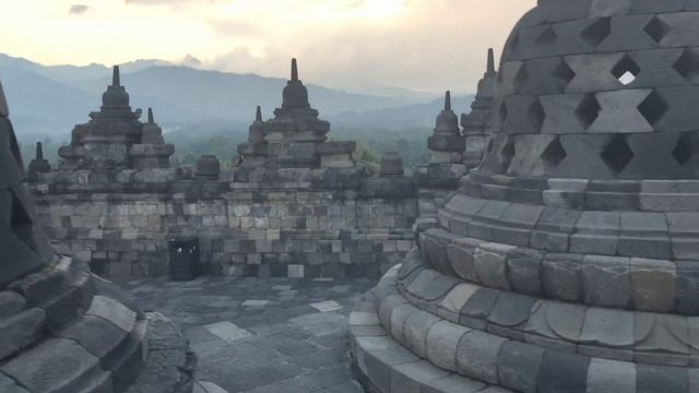 Stupas of the Borobudur Temple in the blaze of the setting sun - Java - Indonesia смотреть онлайн