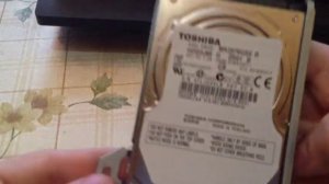 Как снять жесткий диск с PS3 Slim