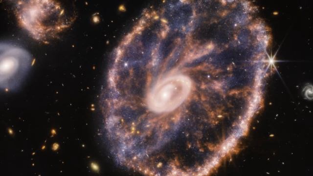 Телескоп Джеймс Уэбб сделал фантастическое фото галактики Колесо Телеги смотреть онлайн