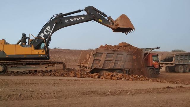 Volvo EC480DL Excavator Loading Scania Trucks