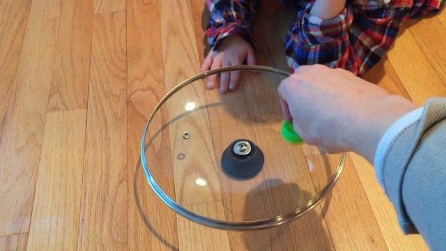 Spinning Top In A Pot Lid Entertains Kids