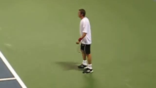 Marat Safin plays a point against Pete Sampras