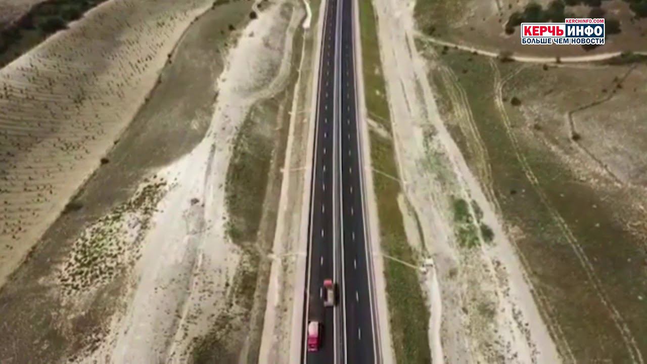 На седьмом этапе трассы Таврида закончена укладка третьего слоя асфальтобетона смотреть онлайн