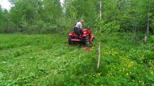 Минитрактор Русич Т-15 в работе с косикой.