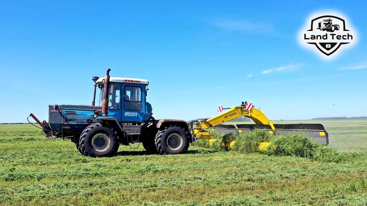 Трактор Т-150К работает с новым иностранным валкообразователем ROC RT 1000! Заготовка кормов! смотреть онлайн