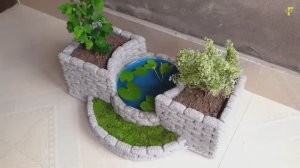 Цветочное кашпо с аквариумом из цемента и пенопласта