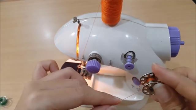 How to use and to wind a bobbin on a portable mini sewing machine with pedal video смотреть онлайн