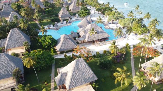 4K Drone Footage of Neptune Pwani Resort, Zanzibar - This Is Mini 2. смотреть онлайн