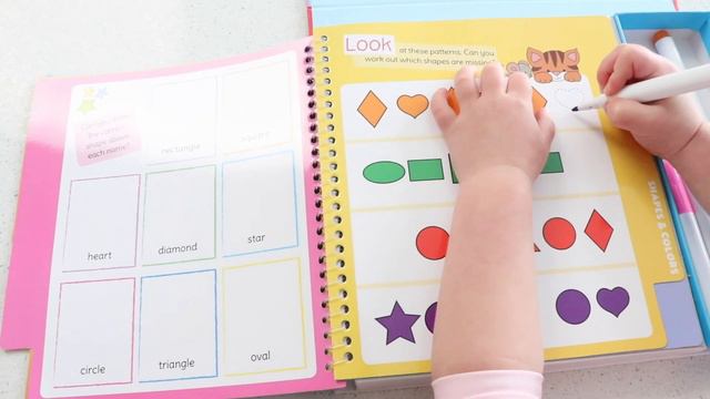 Rora learns about shapes and colors while drawing on new toy book with colored markers. смотреть онлайн