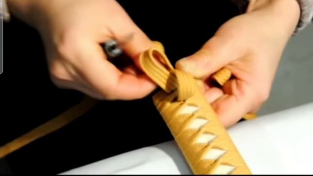 Обмотка рукояти катаны.