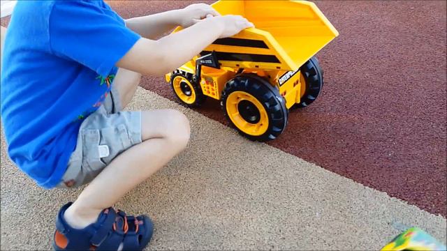 Monster Truck Toy vs Dumptruck Caterpillar Toys Race at the Park Down The Slide Fun Family Playing смотреть онлайн
