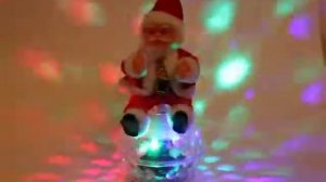 Дед Мороз музыкальный 30 см на шаре (крутится+светится). РЦ "Восток". Артикул: 215-296