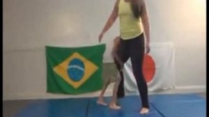very tall woman wrestling with a small man