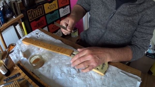 Refinishing a fretboard using water-based Min Wax wipe on poly