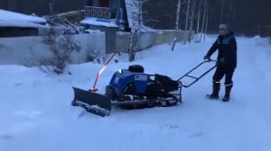 Чистим снег при помощи мотобуксировщика МУЖИК