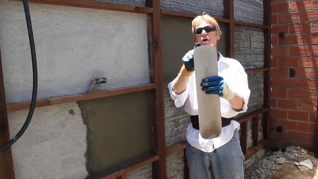 Smooth down the rear of keyed stucco.