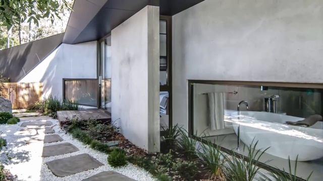 house design with geometry to capture views resulting in a pair of angular shapes смотреть онлайн