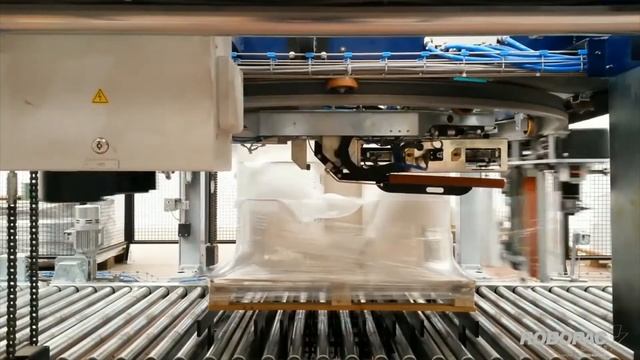 Автоматическая упаковка паллеты стрейч-плёнкой | Кольцевой обмотчик с укрыванием верха ROBOPAC смотреть онлайн