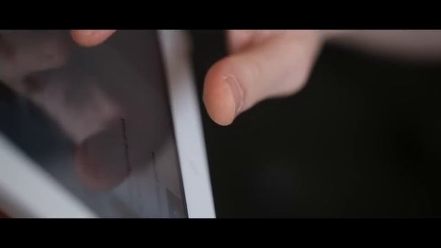 A white iPad holder in a living room смотреть онлайн