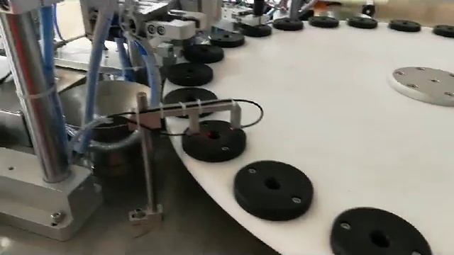 Overall view of completed cartridge placing tube plugging labeling machine смотреть онлайн