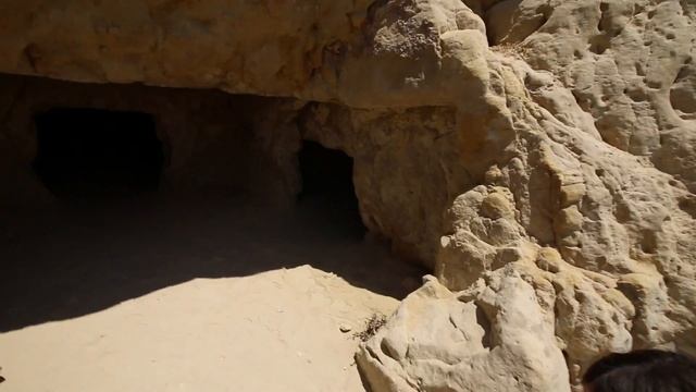 Visit Matala, Greece - Crete's Cool Hippie Beach With Ancient Caves + Awesome Greek Food