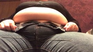 Full fat and stuffed belly in very tight jeans