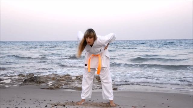 Kyokushin Karate Female Training On A Beach. Part 1 Of 2. Martial Arts Workout Of Fashion Model